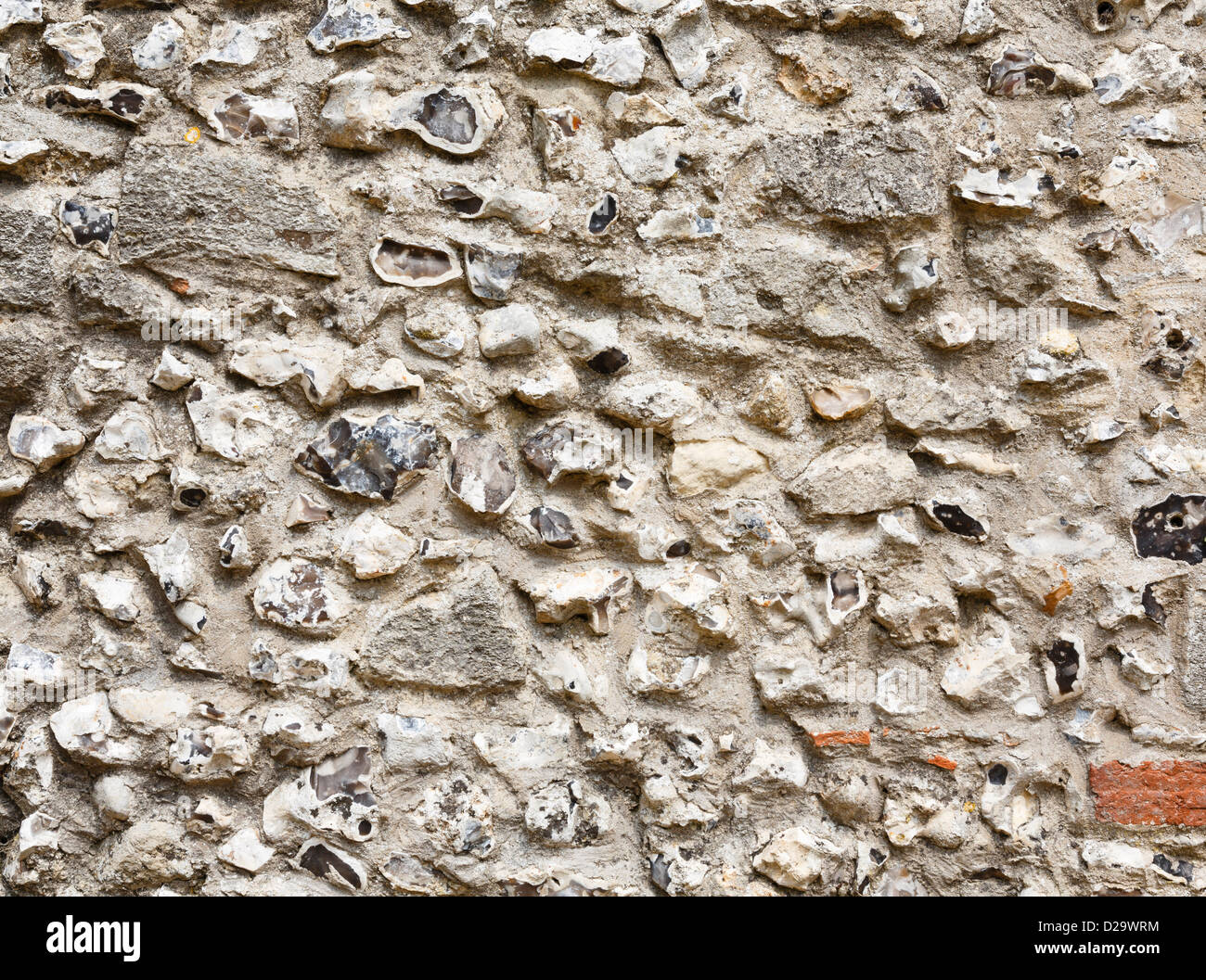 Primo piano di una antica pietra focaia e muratura muro di castello Foto Stock