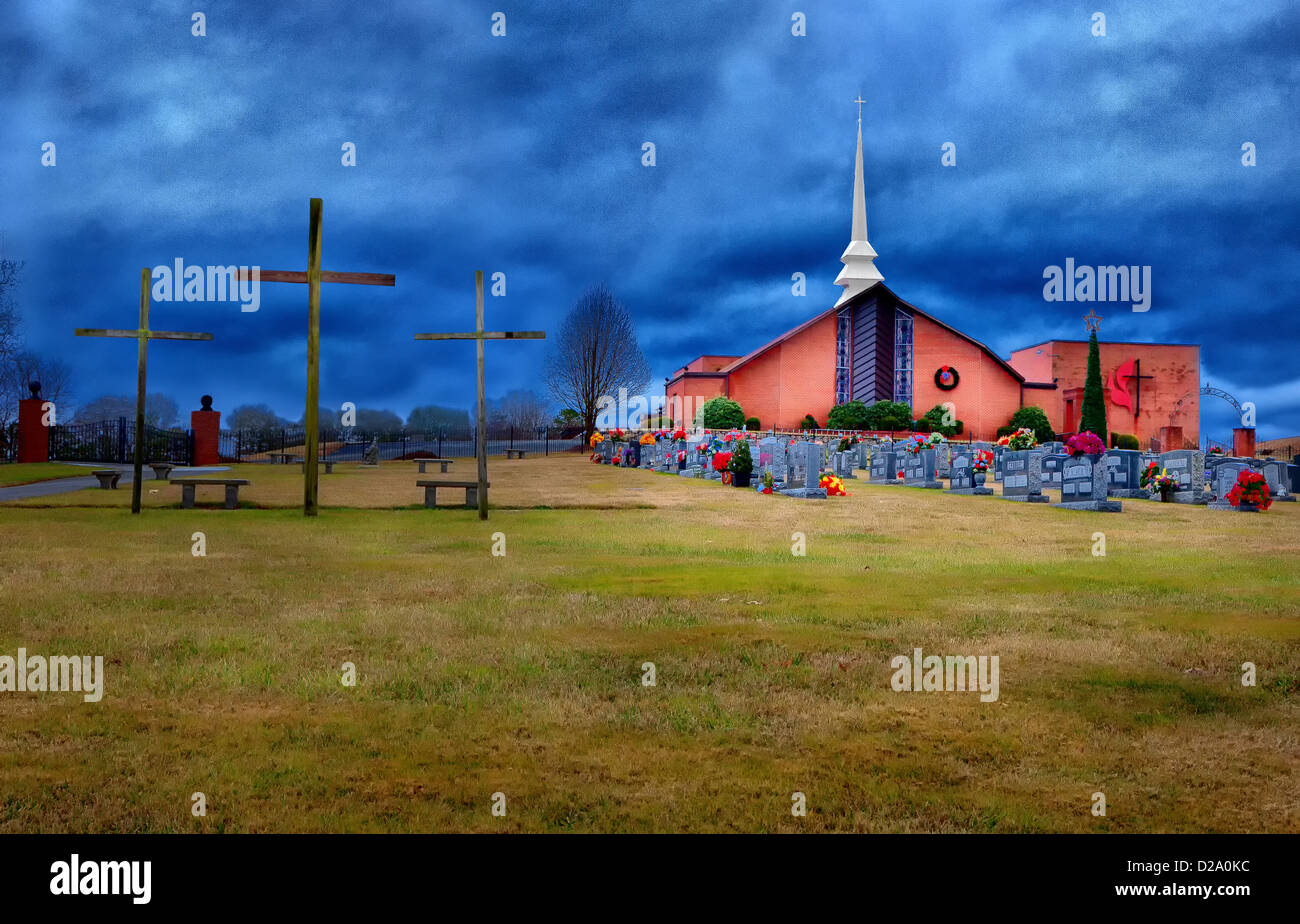 Una immagine colorata di una chiesa cimitero. Foto Stock