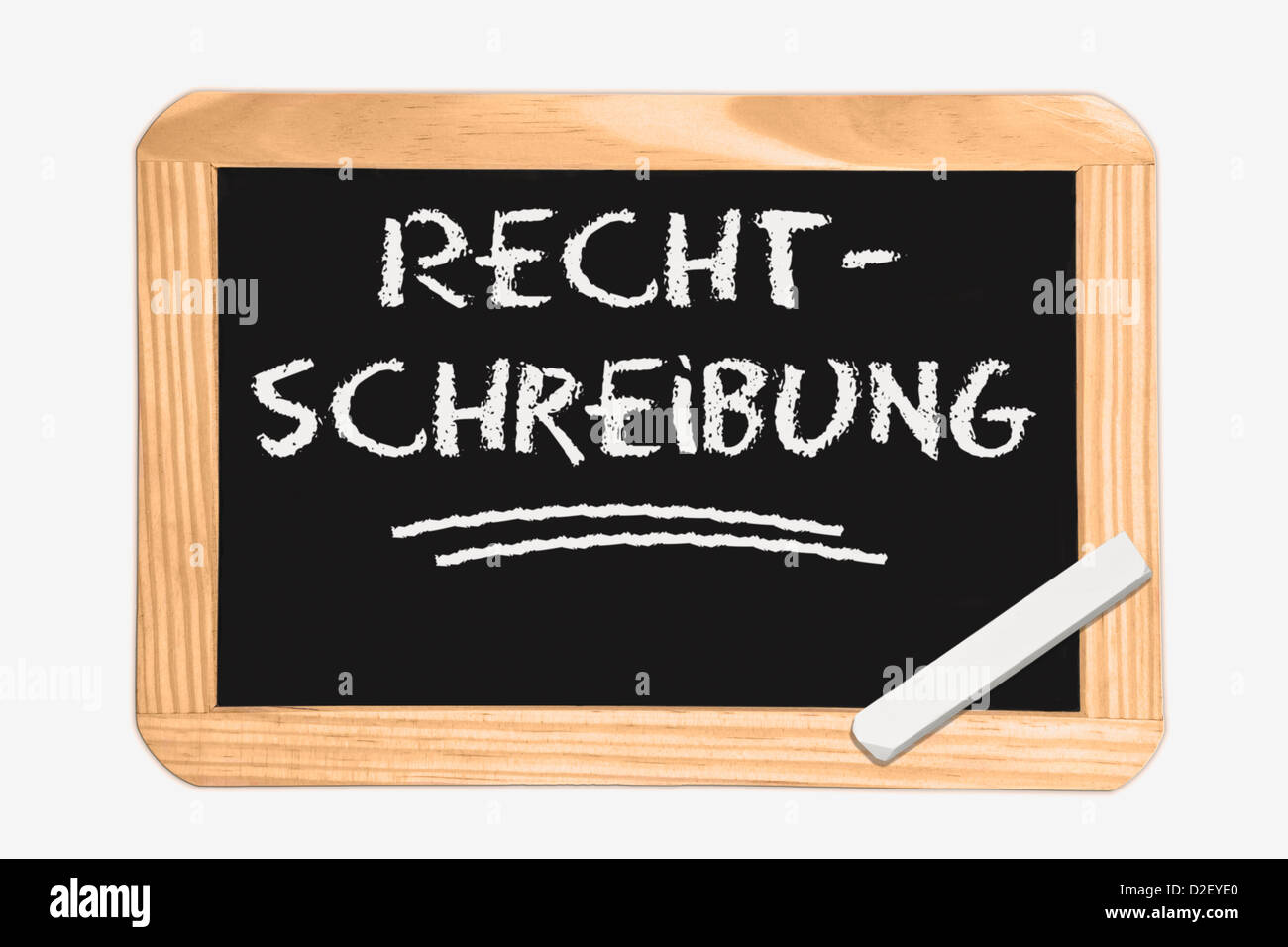 Dettaglio foto di una lavagna con il tedesco iscrizione scritto, bianco gesso si trova in un angolo Foto Stock