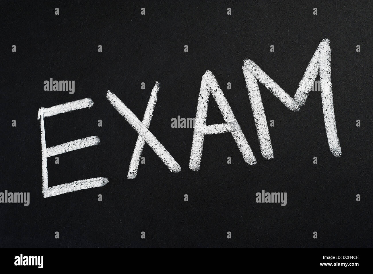 Exam - education concept - written on blackboard Foto Stock