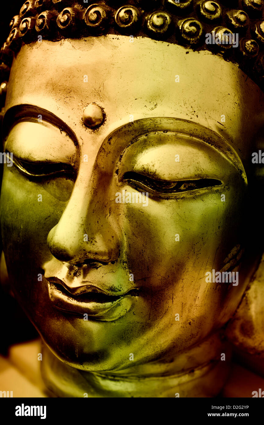 Close up dettaglio di un Buddha d'oro di testa Foto Stock