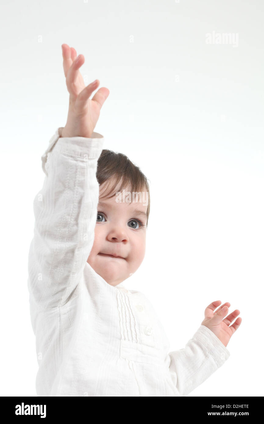 Bambino con una mano su un bianco sfondo isolato Foto Stock