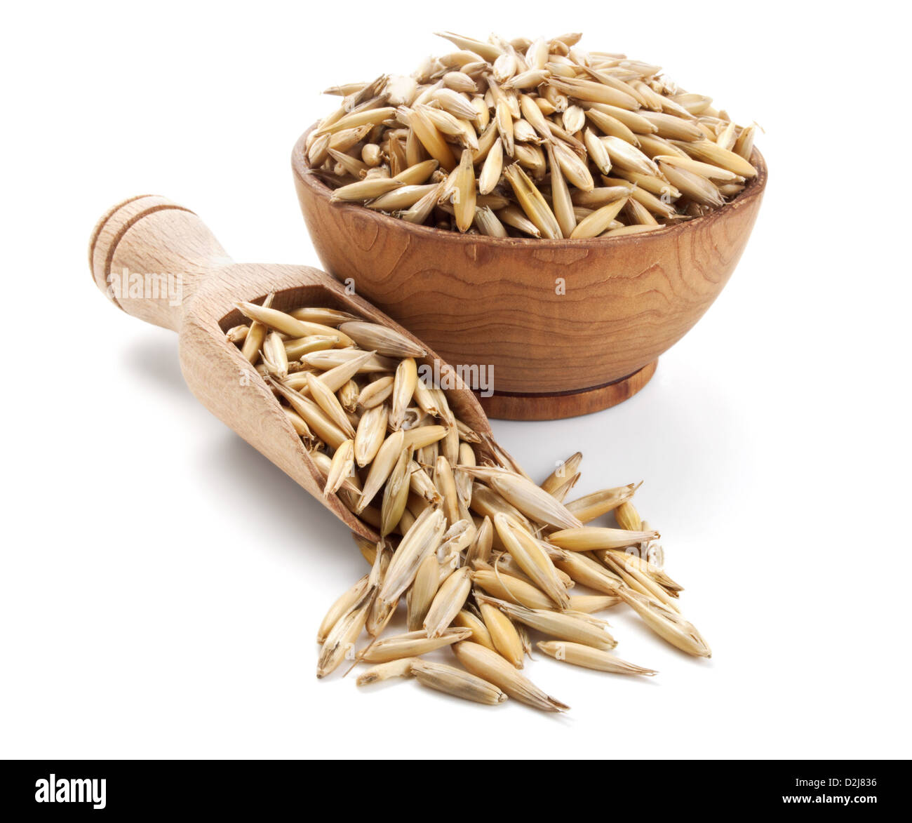 Oat in una ciotola di legno isolato su sfondo bianco Foto Stock