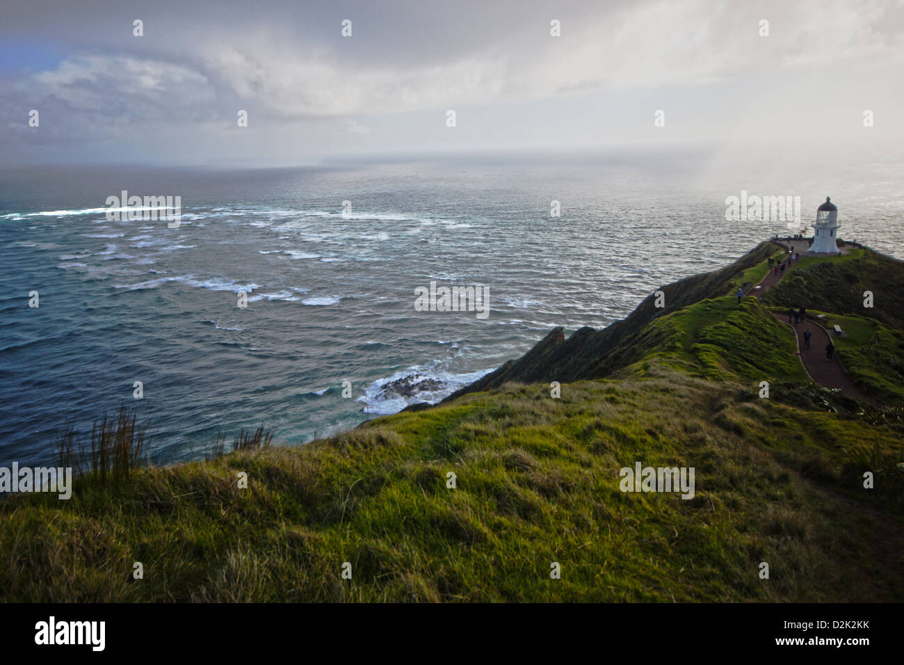 Dove il Tasman e del Pacifico si incontrano. Cape Reinga, punta settentrionale dell'Isola del nord, Nuova Zelanda. Foto Stock