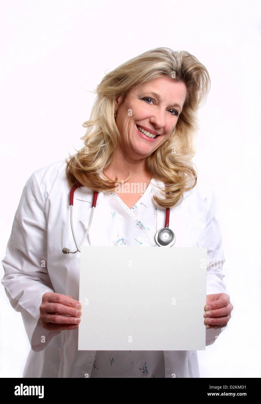Una donna medico con un segno bianco Foto Stock