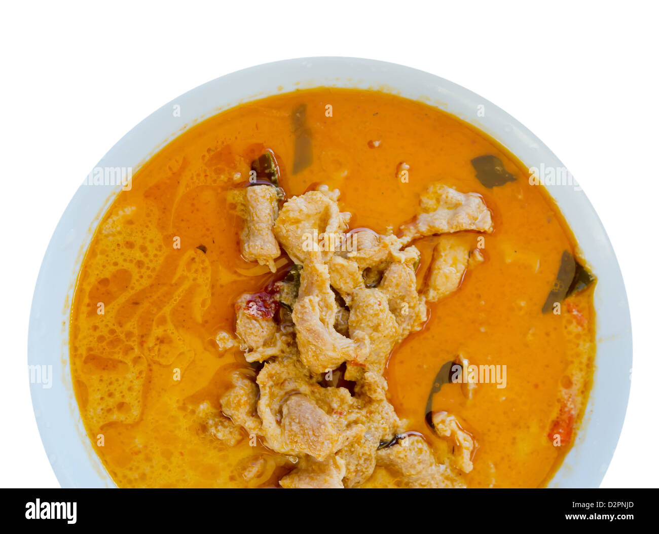 Vista da sopra la carne di maiale in massa di arachidi Crema di Cocco curry su sfondo bianco Foto Stock