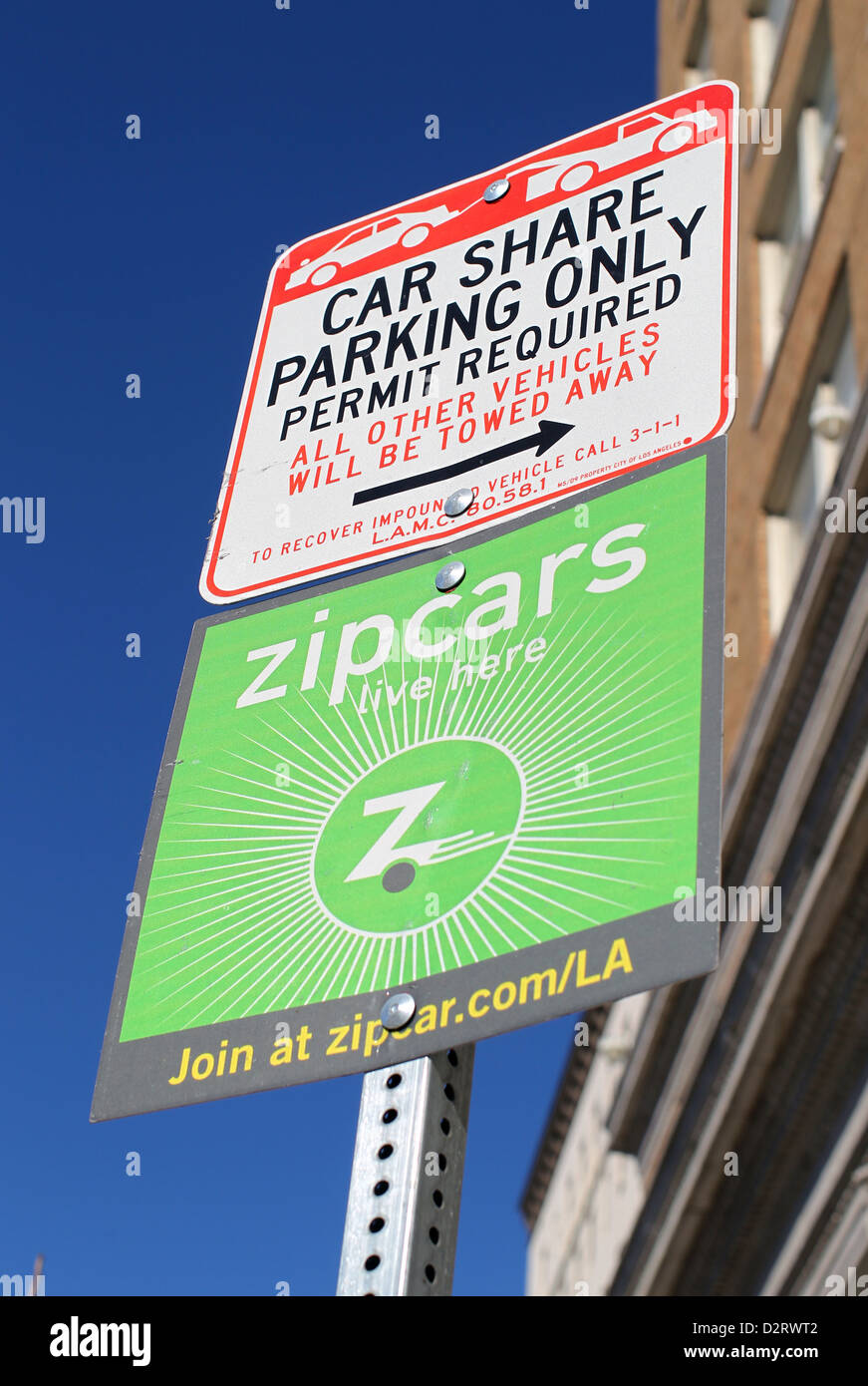 Zip auto e un condividere solo simbolo di parcheggio a Los Angeles. Foto Stock