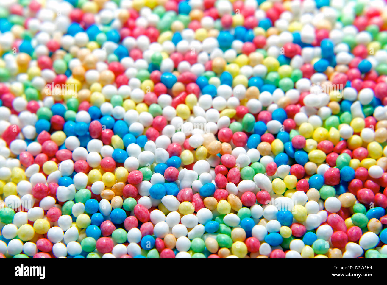 Primo piano della brighly torta colorata spruzza. Buona per lo sfondo. Foto Stock