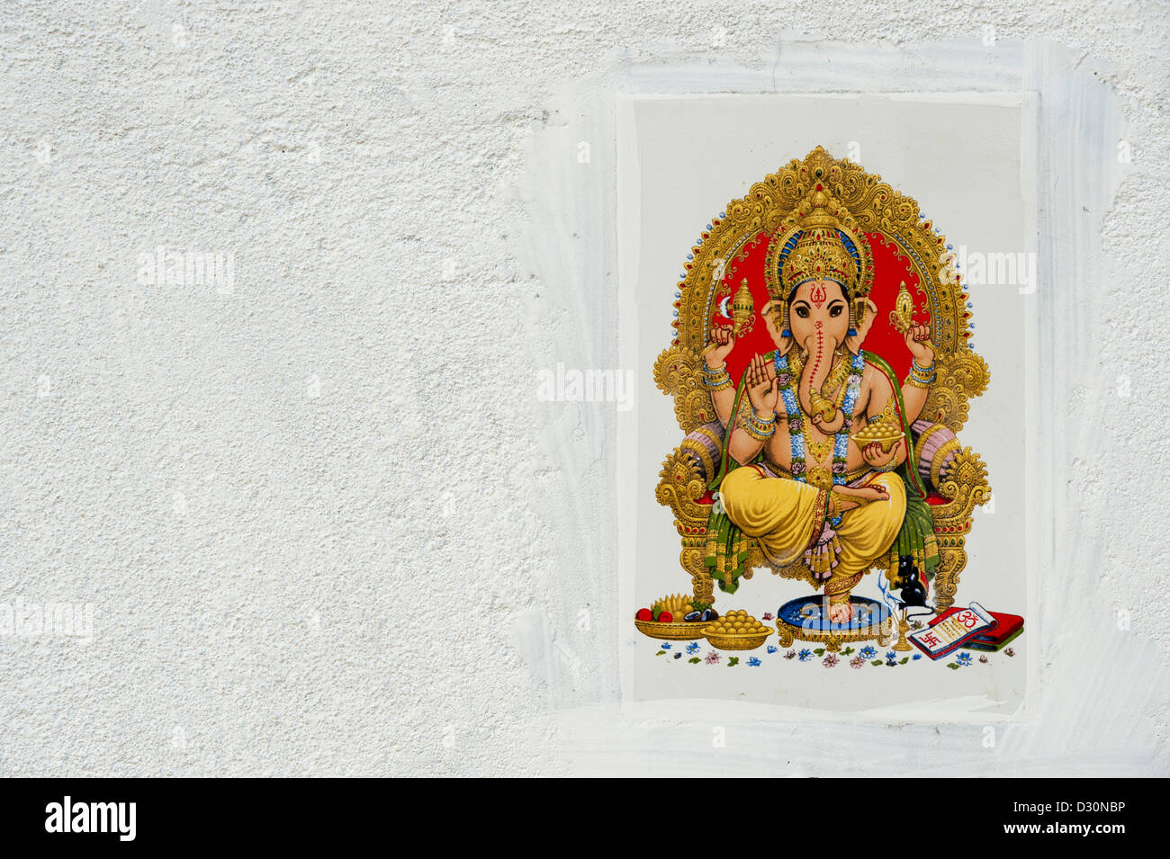 Signore Ganesha immagine su un tile set in un indiano muro di casa. Andhra Pradesh, India Foto Stock