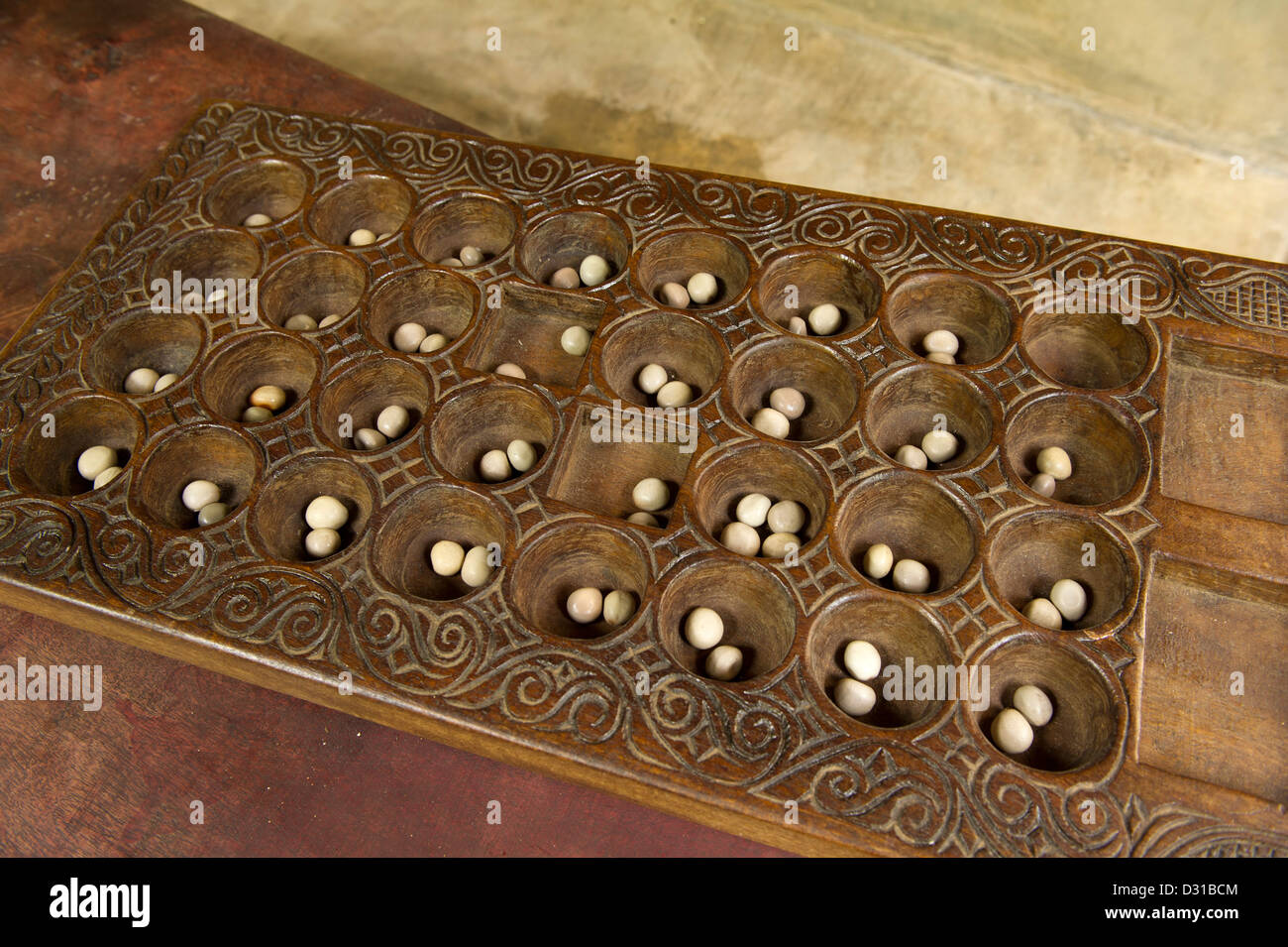 Bao gioco, Lamu, l'arcipelago di Lamu, Kenya Foto Stock