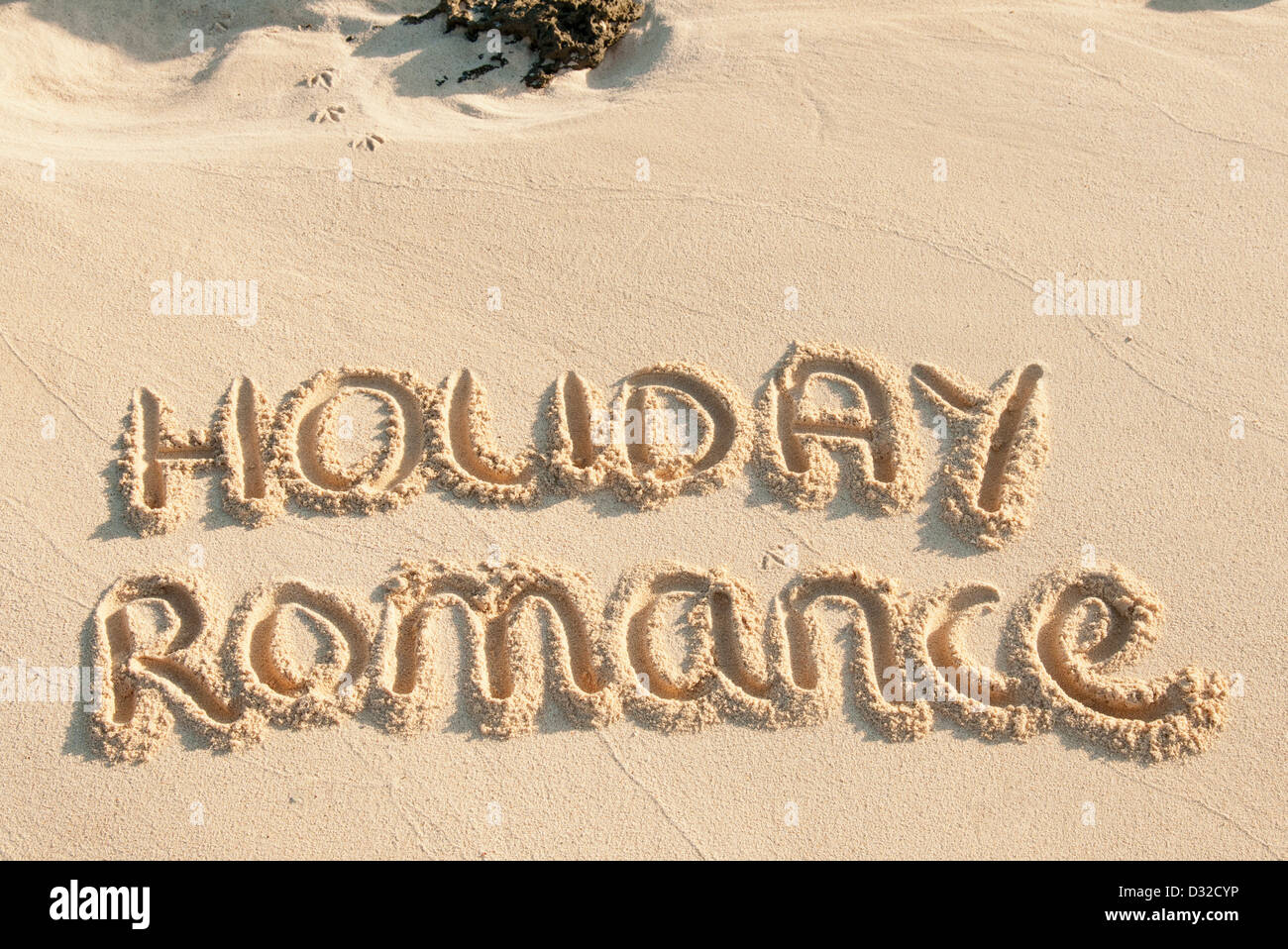 Holiday romance scritto di sabbia su una spiaggia Foto Stock