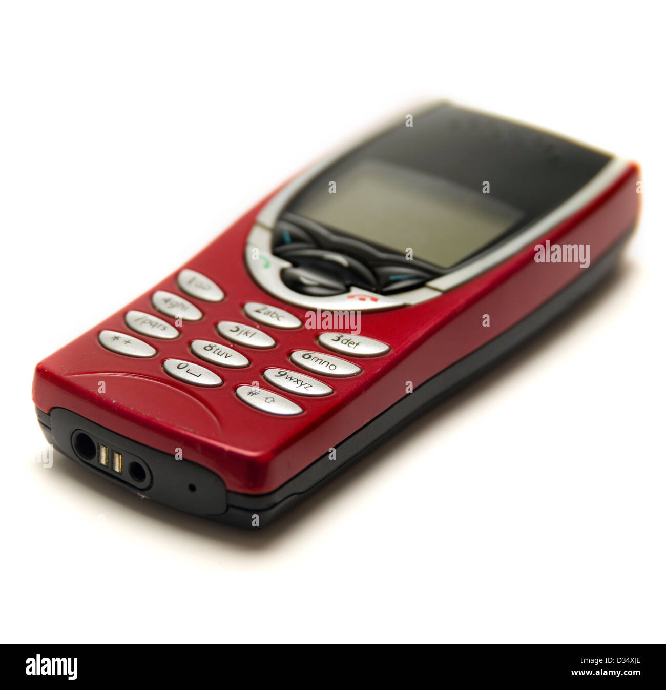 Vecchio rosso telefono cellulare isolato su sfondo bianco Foto Stock