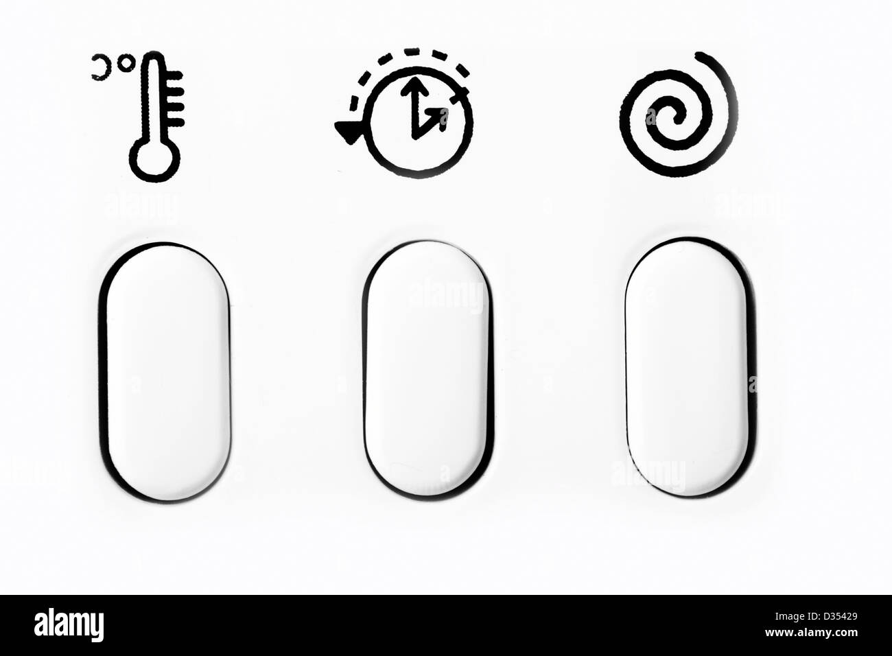 Pulsanti dal lato anteriore di un pannello di lavanderia. Foto Stock