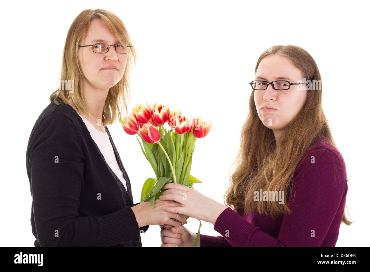 Donne quarreling oltre i tulipani Foto Stock