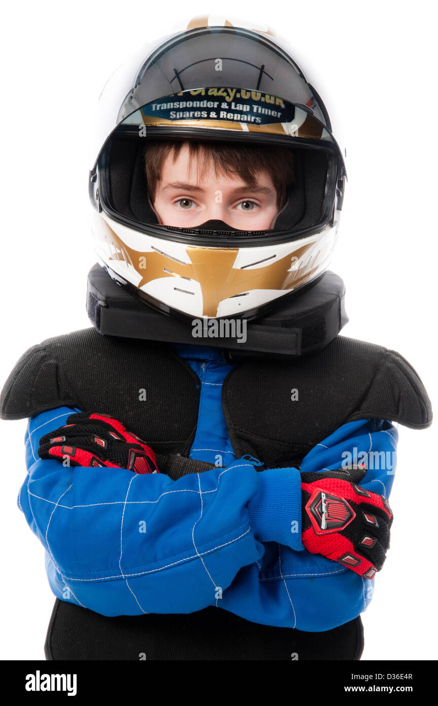 Bambino Motorsport indossare abbigliamento protettivo Foto Stock