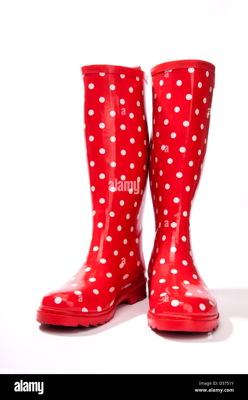 Il bianco e il rosso polka dot gumboots rivolto in avanti leggermente aperto Foto Stock