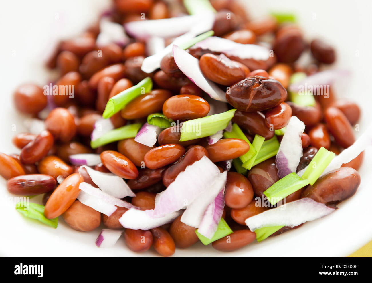 I fagioli cotti con cipolla closeup, cibo Foto Stock