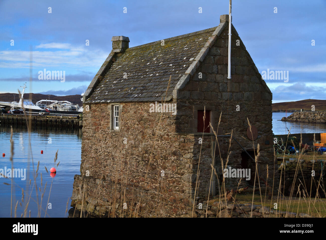 Il piccolo molo House Museum, un ex böd o deposito a Symbister su Whalsay, Isole Shetland Foto Stock