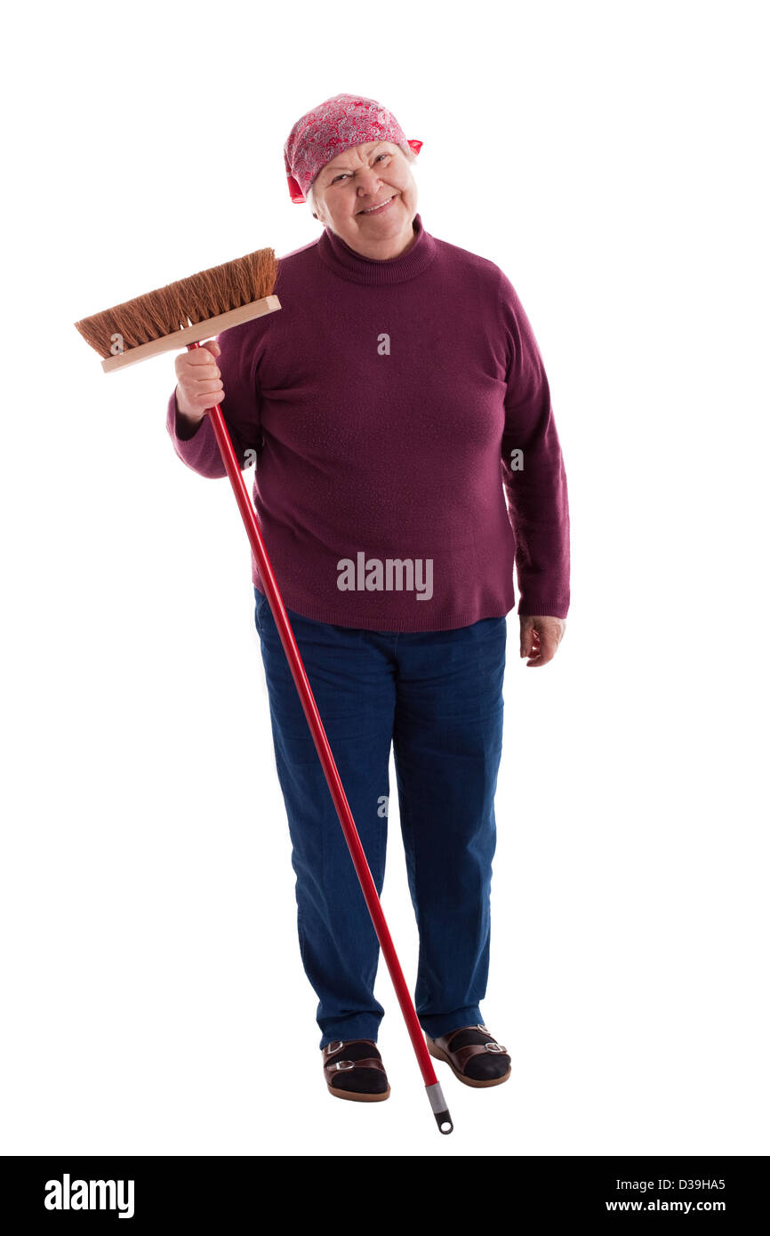 Vecchia donna spazza il pavimento Foto Stock