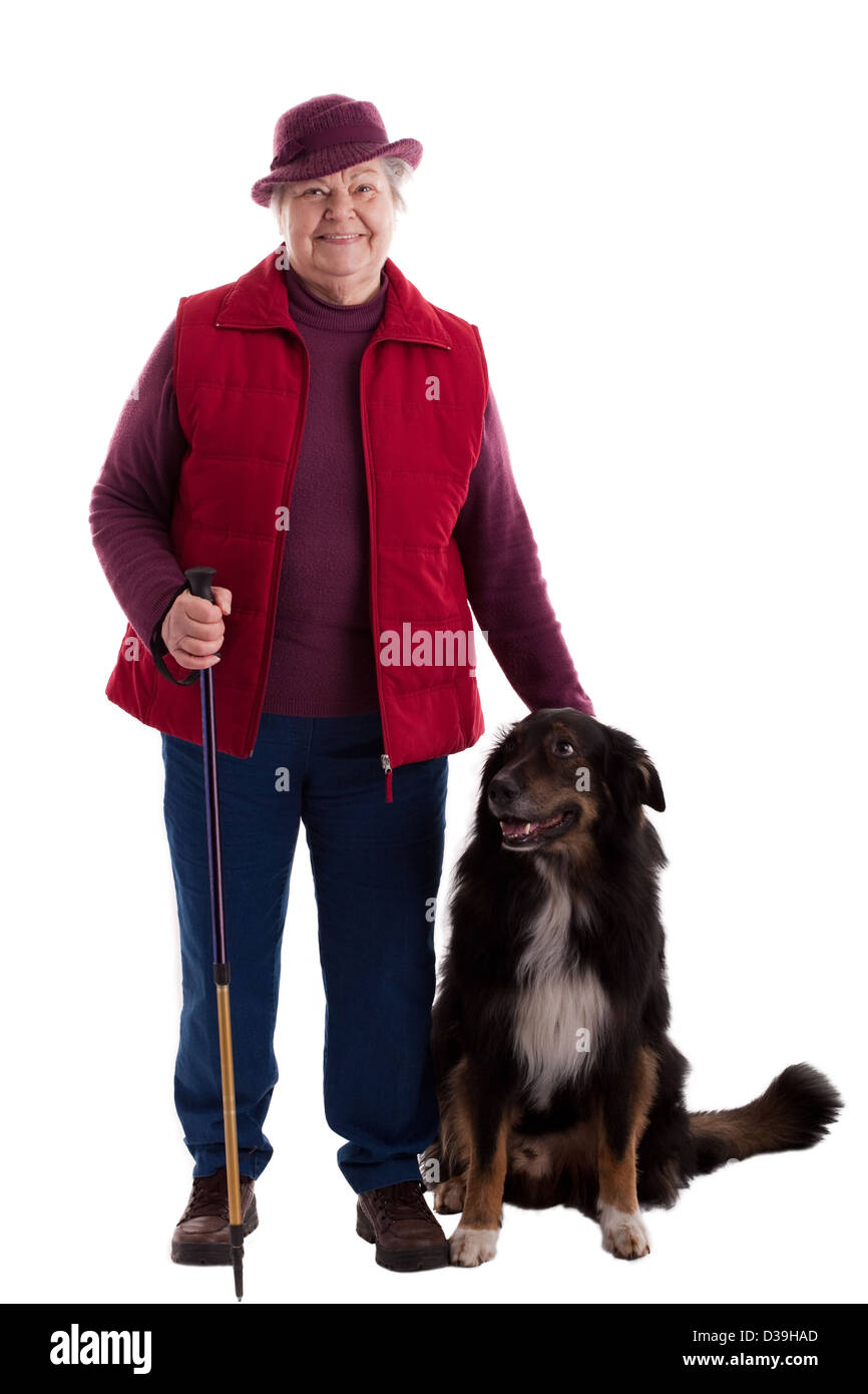 Un lusty senior femminile con cane guarda al visualizzatore Foto Stock