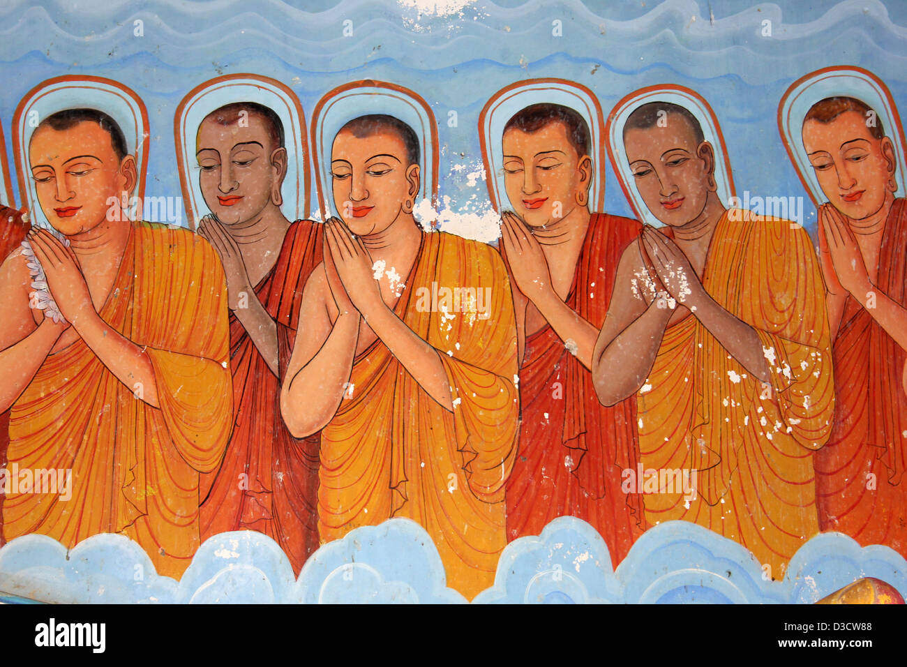 Linea di monaci buddisti dipinto sul muro del tempio Isurumuniya, Sri Lanka Foto Stock