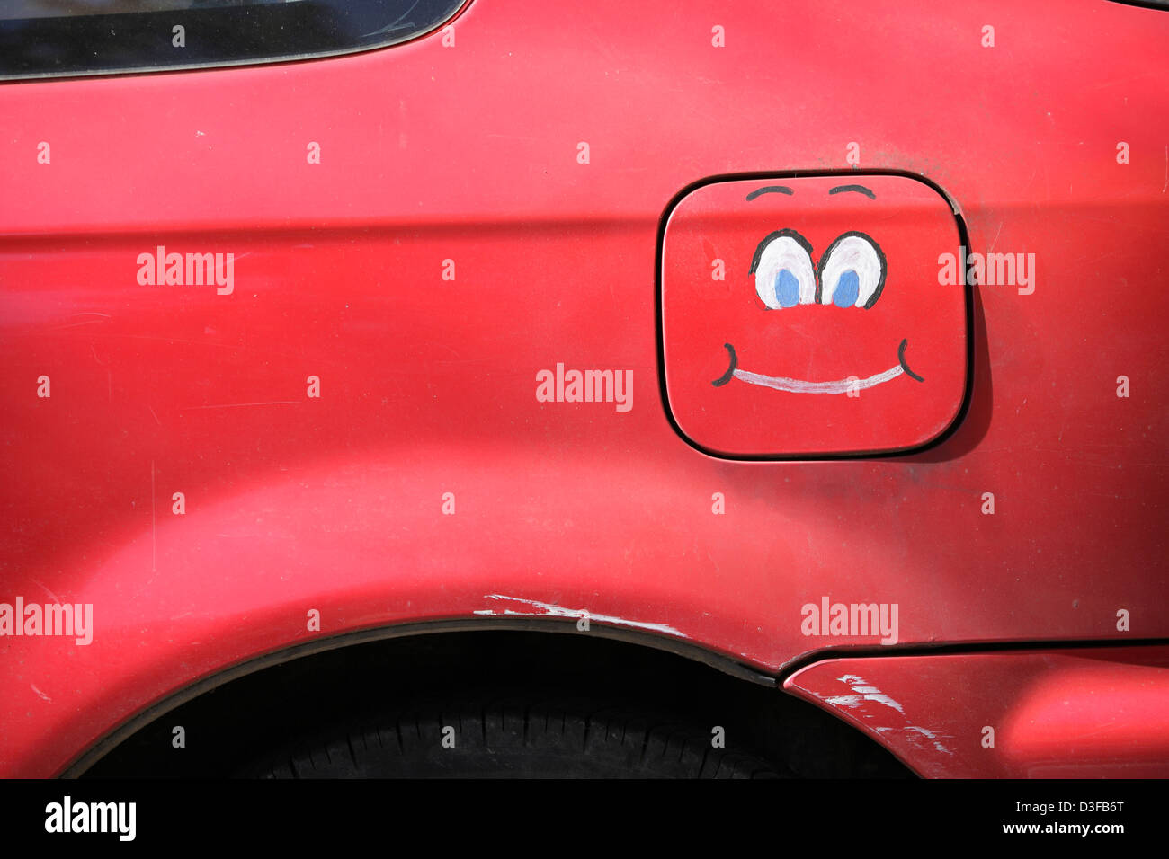 Faccia felice dipinta su una automobile serbatoio del carburante porta, STATI UNITI D'AMERICA Foto Stock
