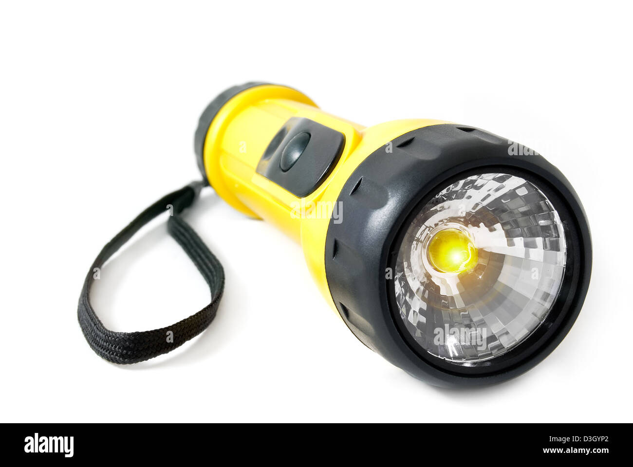 La torcia elettrica giace su un fondo bianco Foto Stock