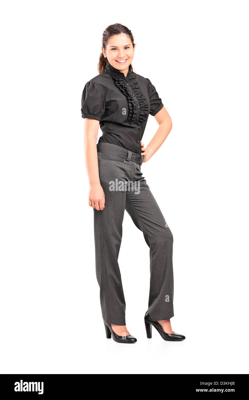 A piena lunghezza Ritratto di una giovane donna professionale ponendo isolati su sfondo bianco Foto Stock