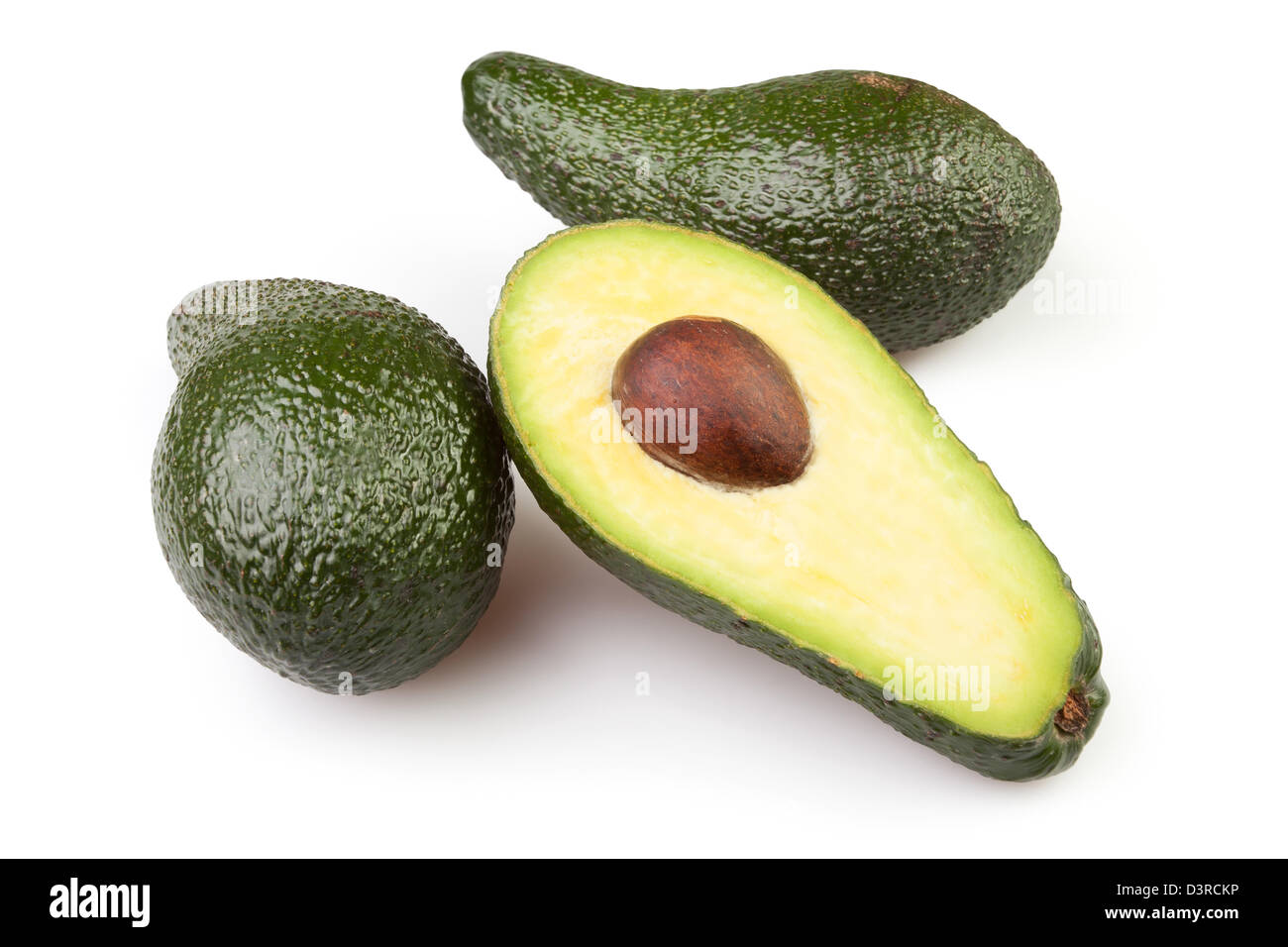 Avocado tagliati su sfondo bianco Foto Stock