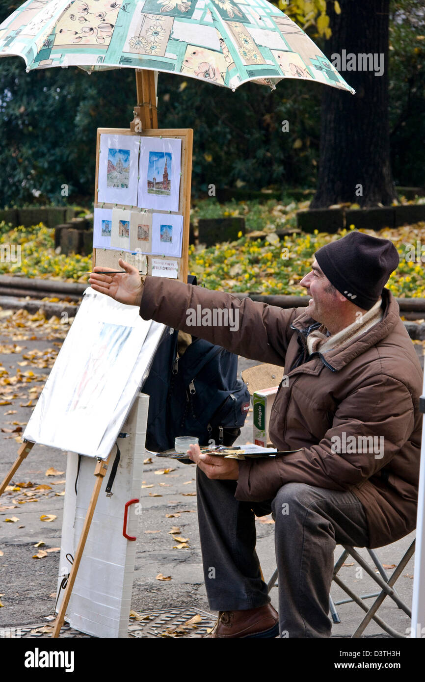 L'artista di strada pittura acquerelli in autunno il giorno milano lombardia italia Europa Foto Stock