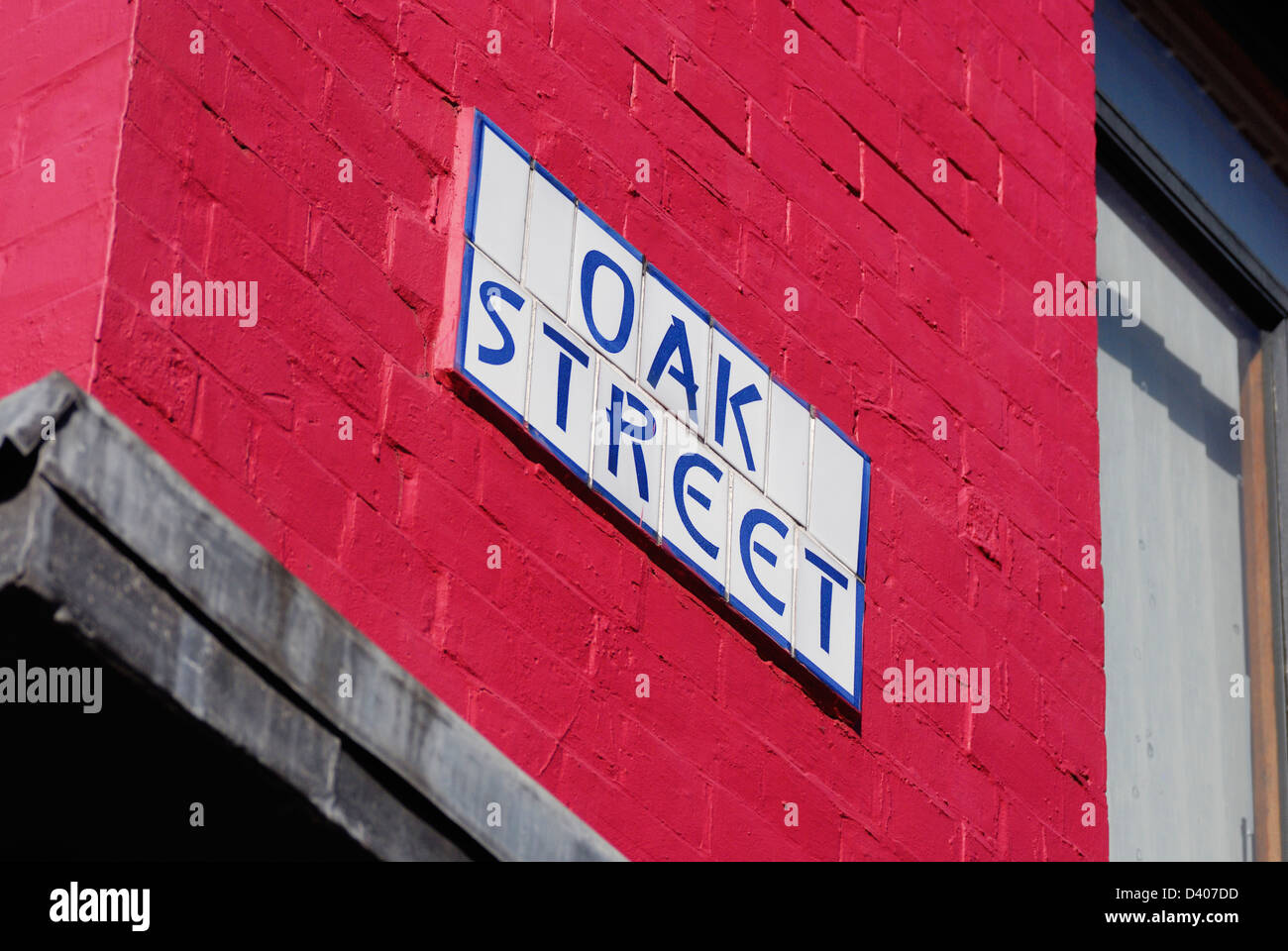 Oak Street segno sul lato di Thomas Street Old Post Office edificio di Manchesters Northern Quarter - Quartiere culturale Foto Stock