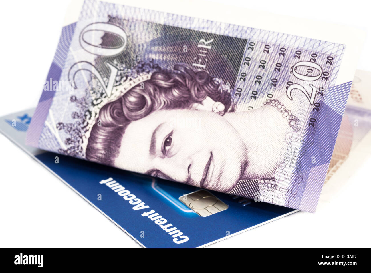 In prossimità di una ventina di Pound nota con un conto corrente carta bancaria, su uno sfondo bianco. Foto Stock