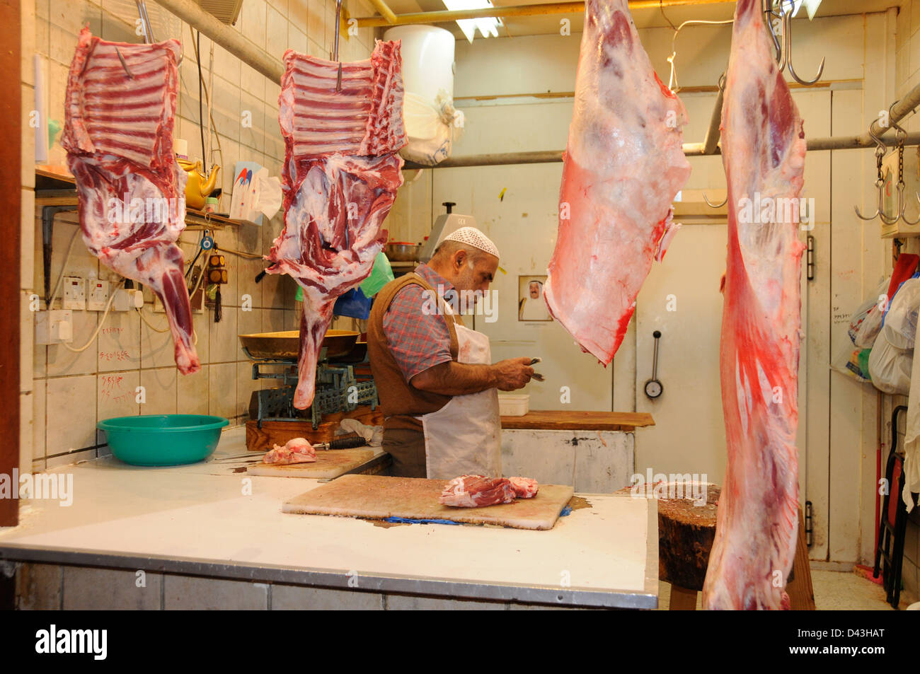 Butcher contando il reddito del giorno, Foto Stock