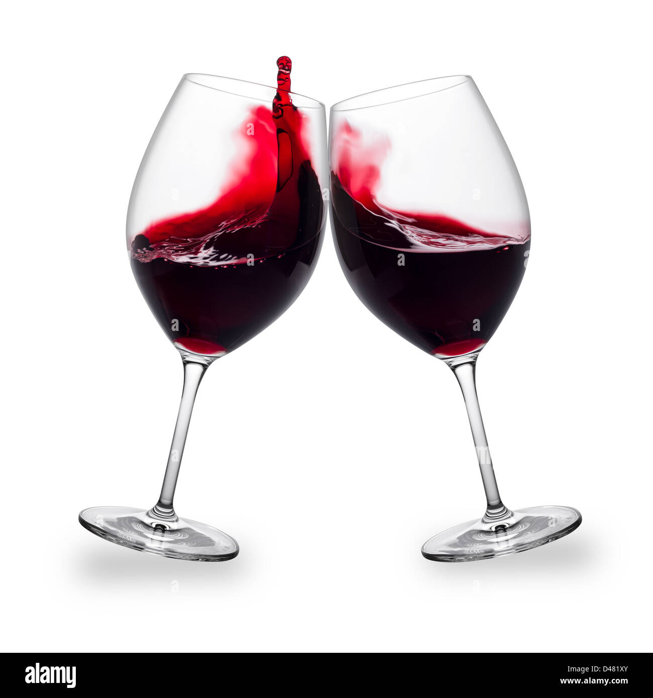 Due bicchieri di vino rosso con schizzi Foto Stock
