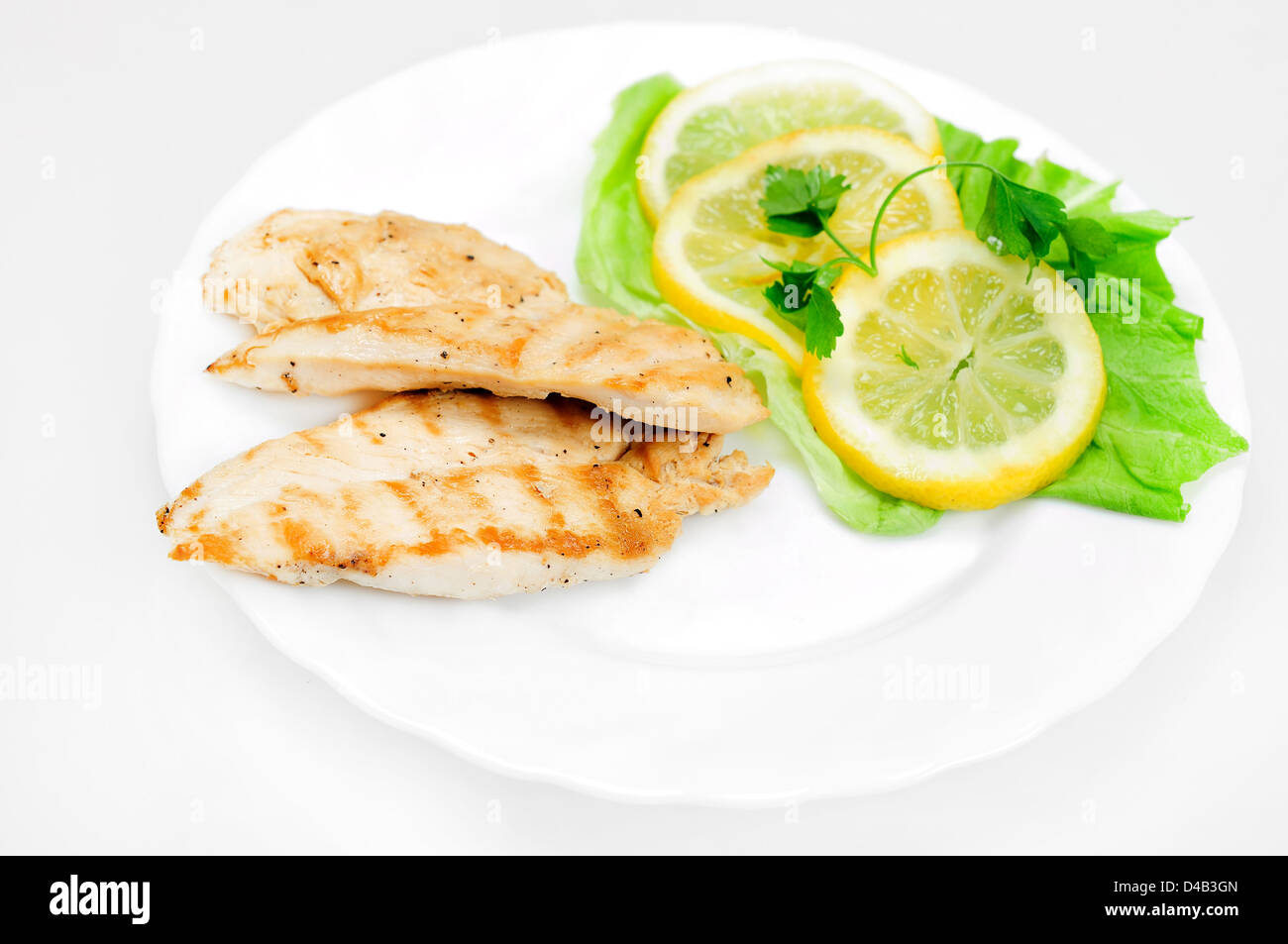 Grigliata di petto di pollo con il limone Foto Stock