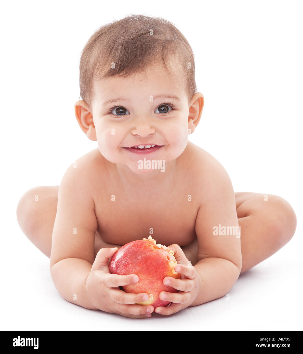 Happy baby con un big apple nelle sue mani. Isolato su uno sfondo bianco. Foto Stock