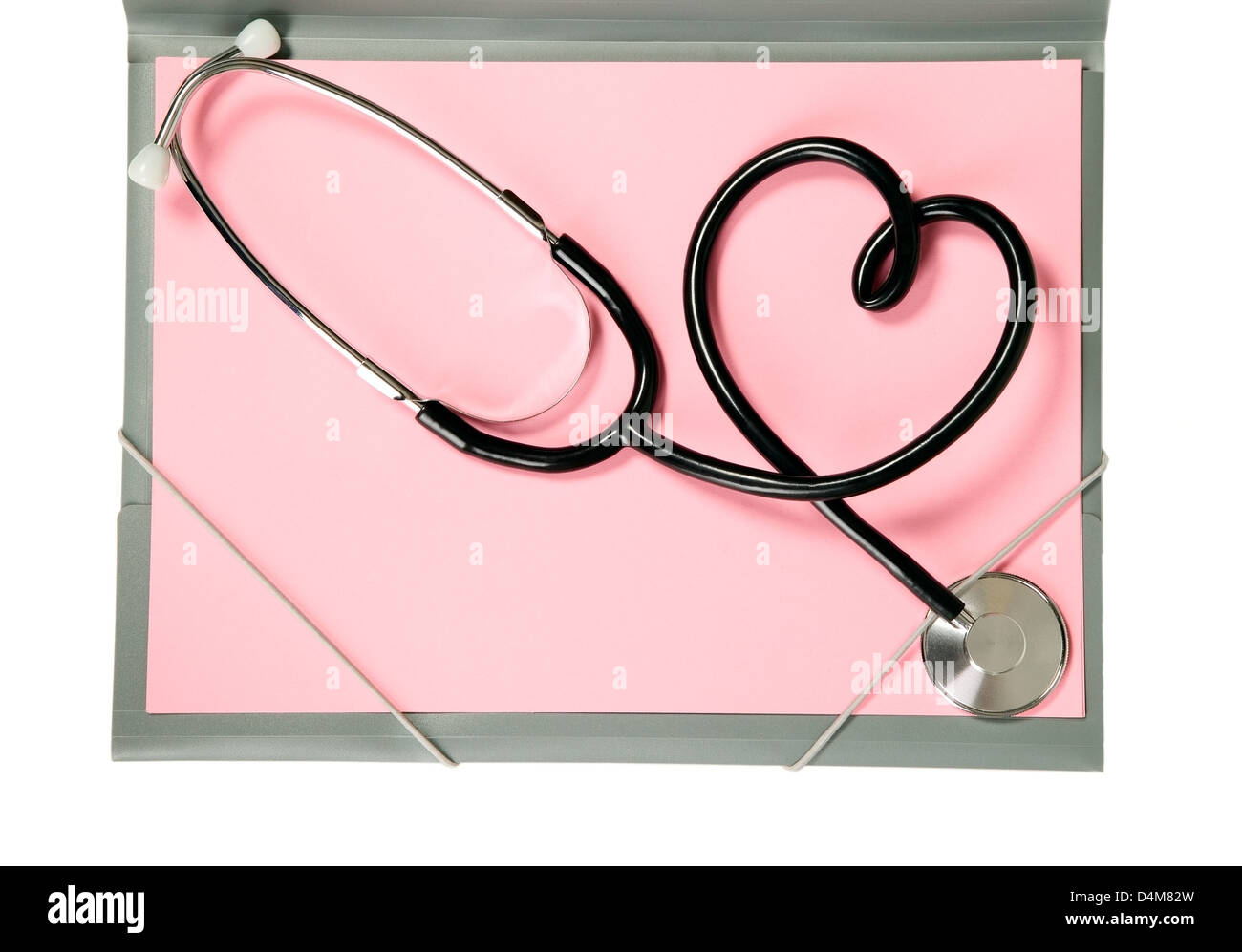 Una medicina stetoscopio è giacente sulla carta rosa Foto Stock