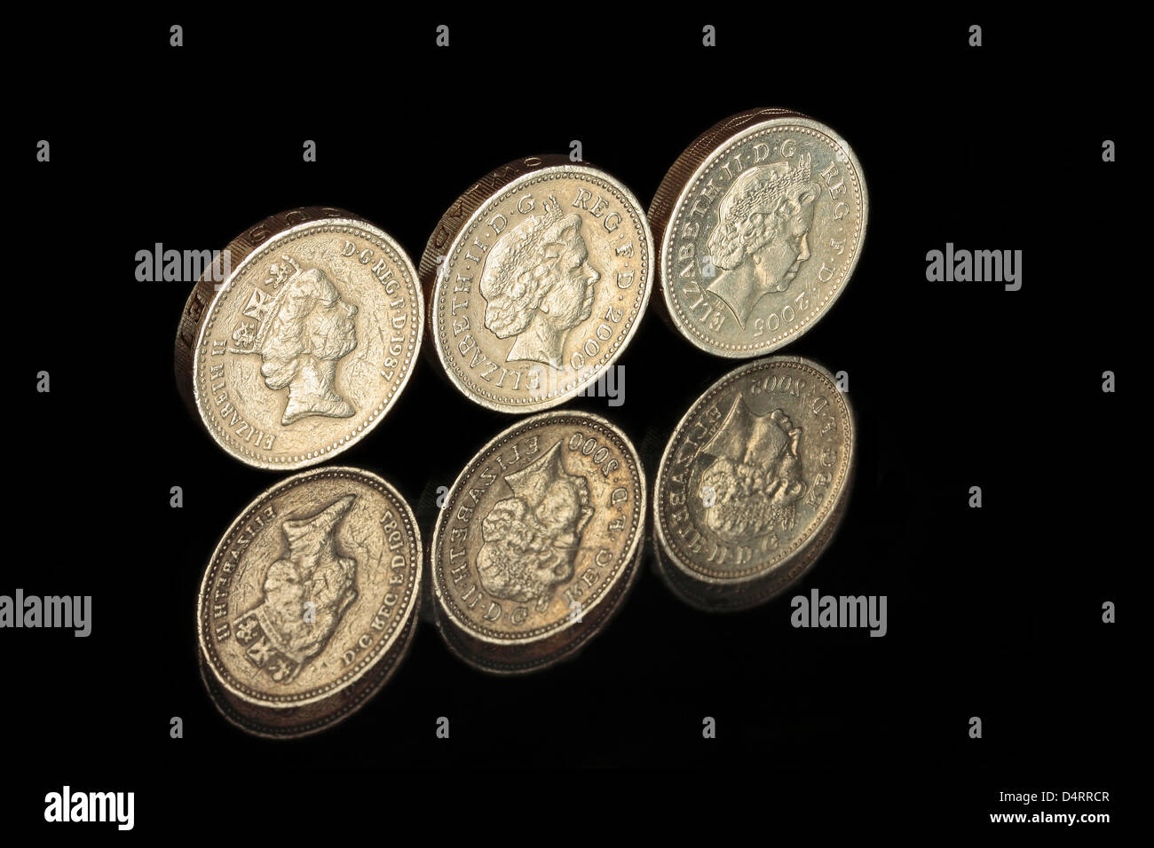 Tre una libbra di monete in una riga Foto Stock
