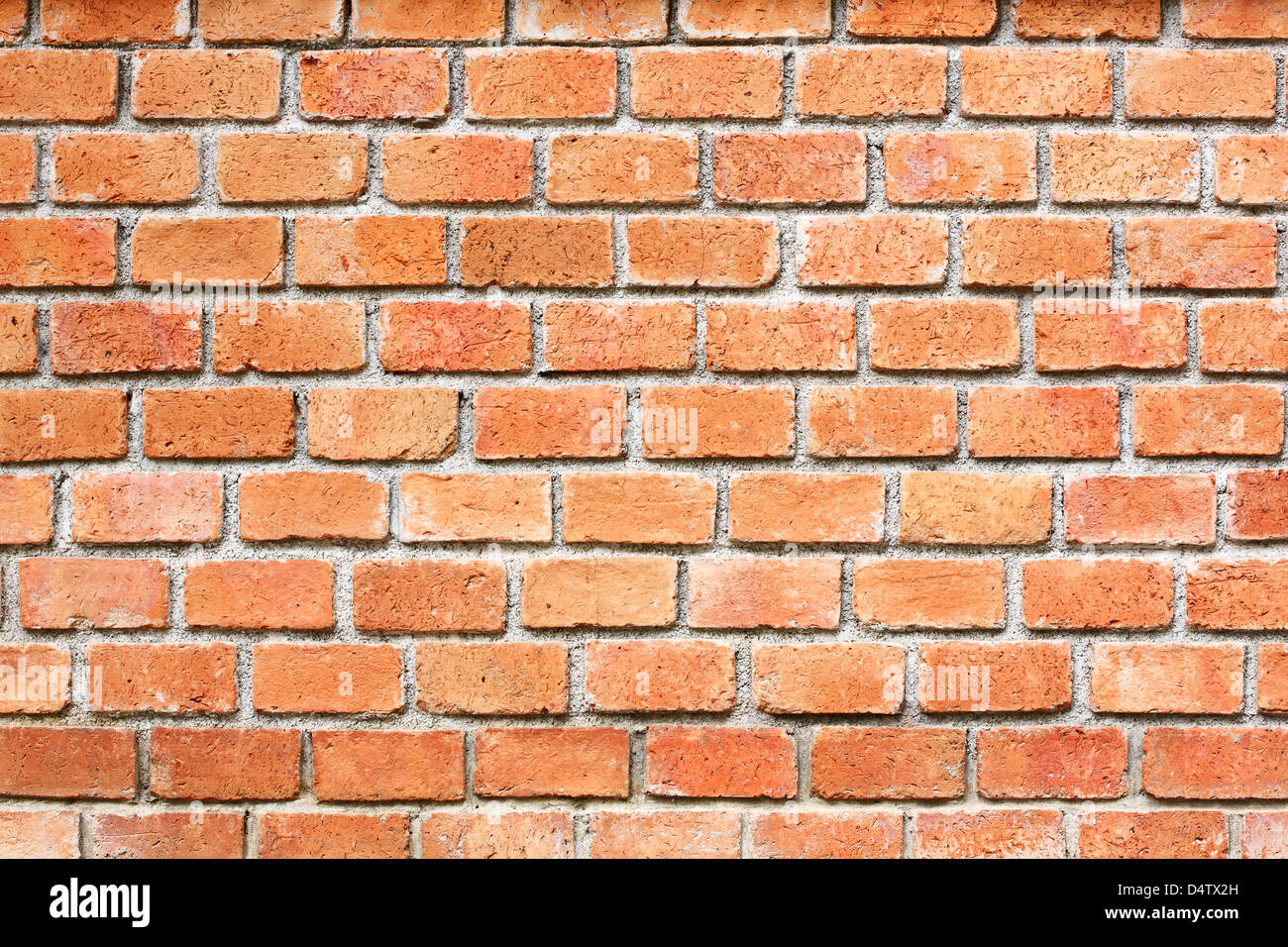 Rosso tailandese muro di mattoni all'esterno dell'edificio. Foto Stock