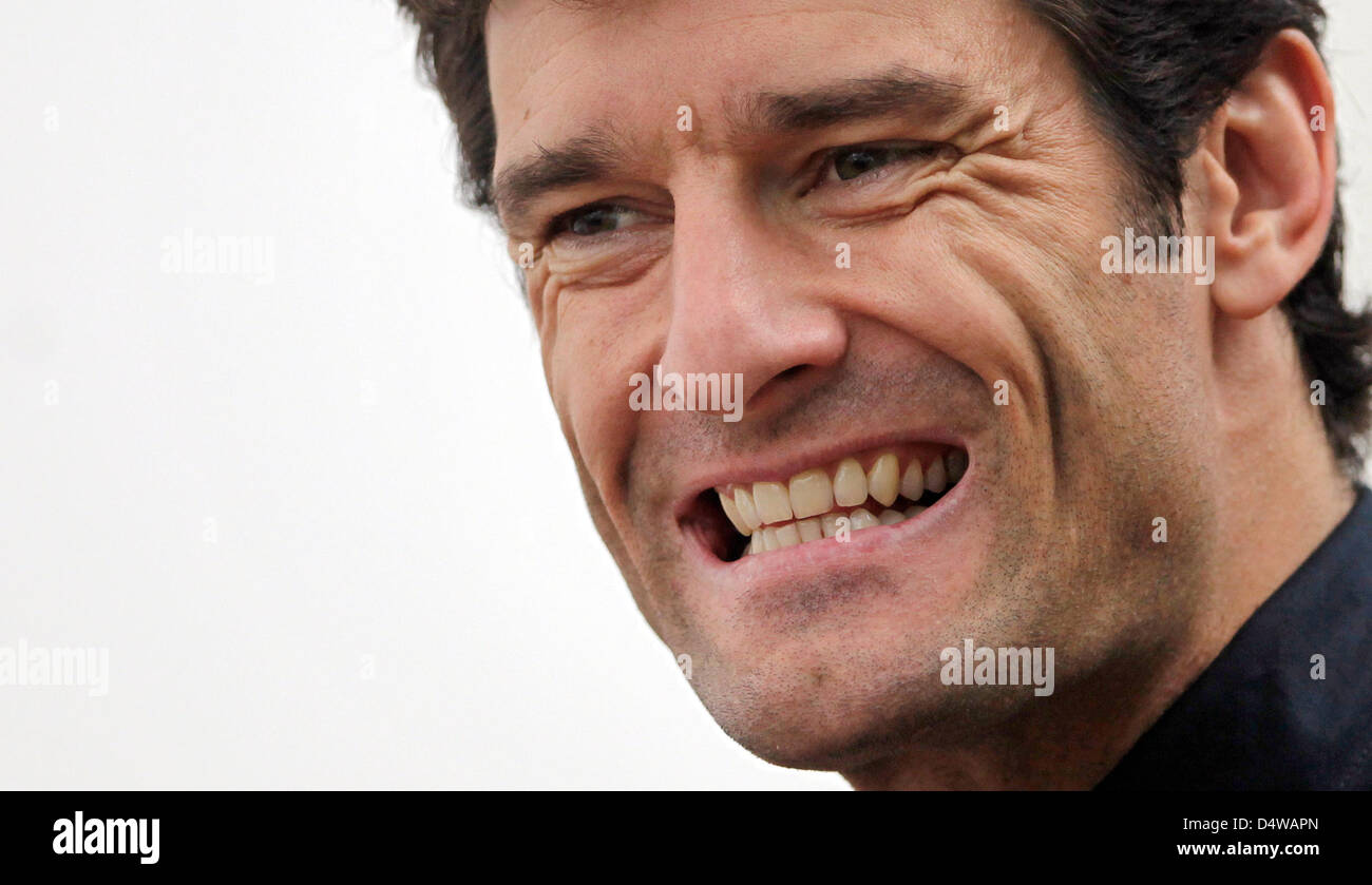 Australian Formula One driver Mark Webber della Red Bull mostra i suoi denti al paddock di Singapore, 23 settembre 2010. La formula di una gara in notturna per il Grand Prix di Singapore si svolgerà presso il porto di Singapore gara sul circuito 26 settembre 2010. Foto: Jan Woitas Foto Stock