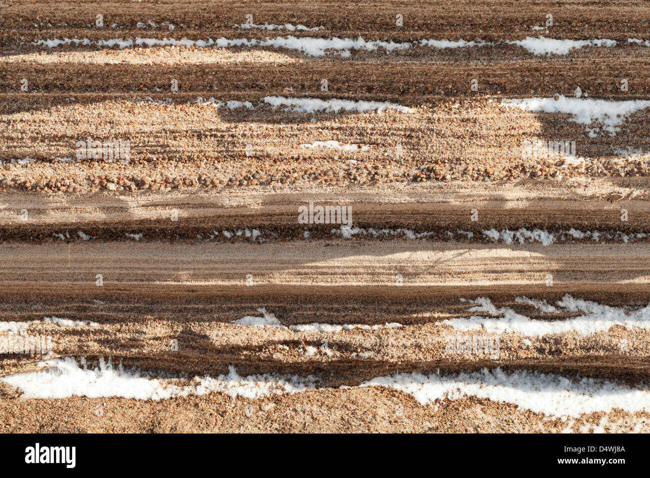 Strati di sabbia costiera e neve texture di sfondo Foto Stock