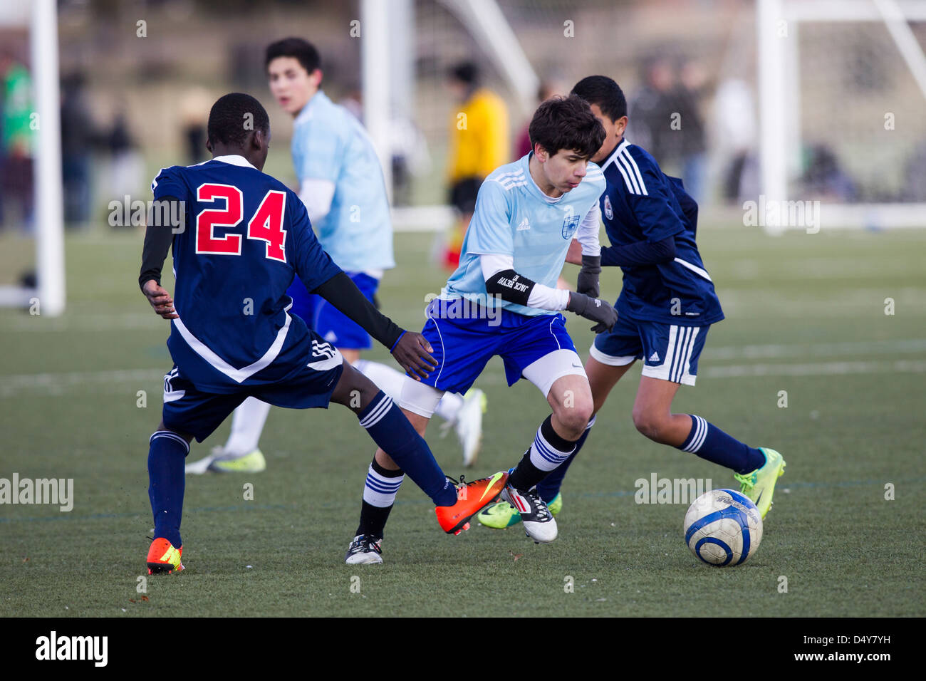 Teen boys soccer azione. Foto Stock