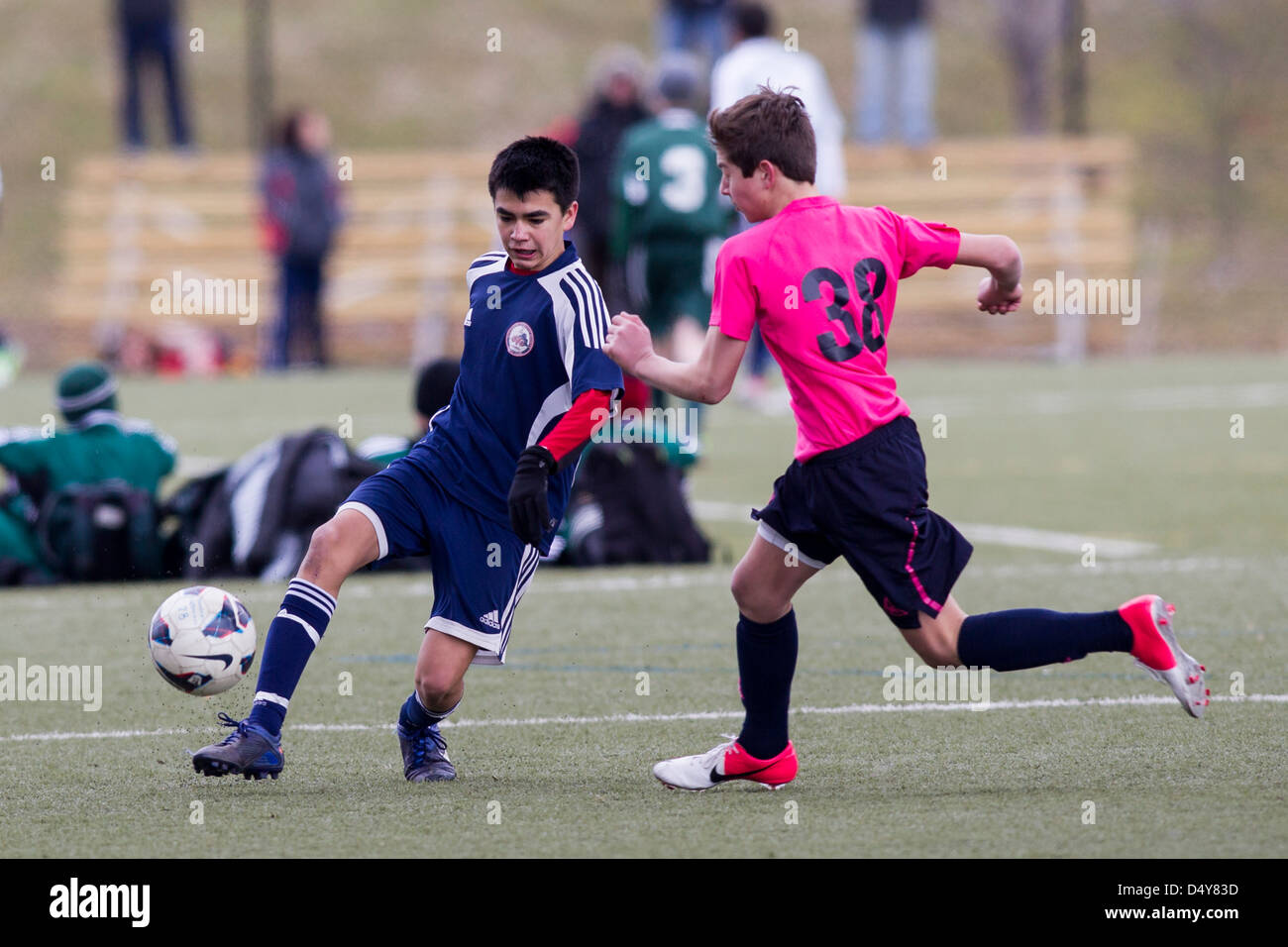 Teen boys soccer azione. Foto Stock