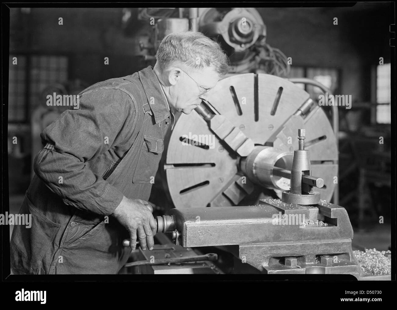 Parti della ferrovia. Locomotiva Baldwin opere. Utensile di piallatura builder per una rastremazione sul cassone di un martello a vapore di ram, Marzo 1937 Foto Stock
