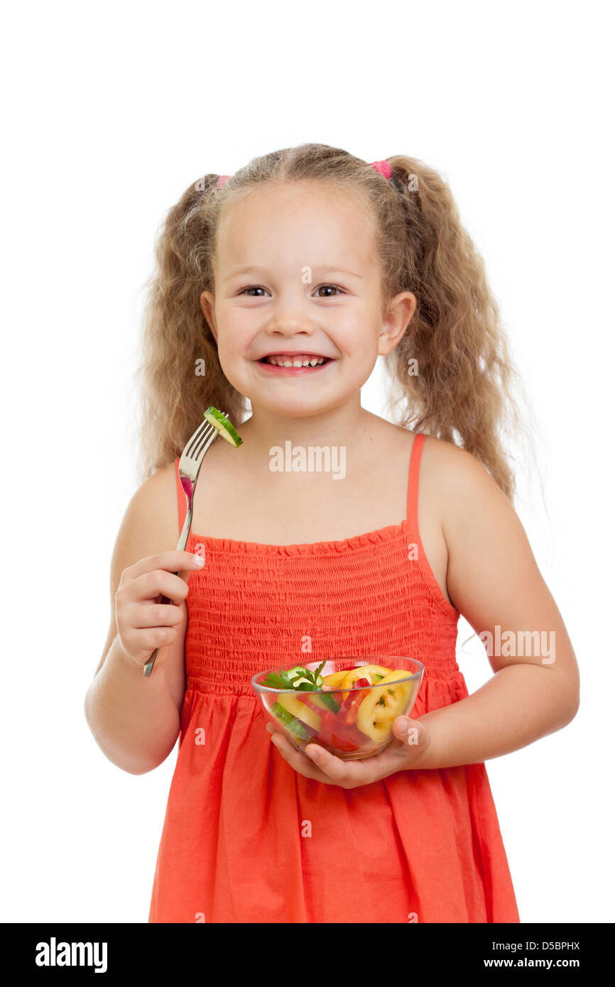 Ragazza bambino mangiare con cibo sano e verdure Foto Stock