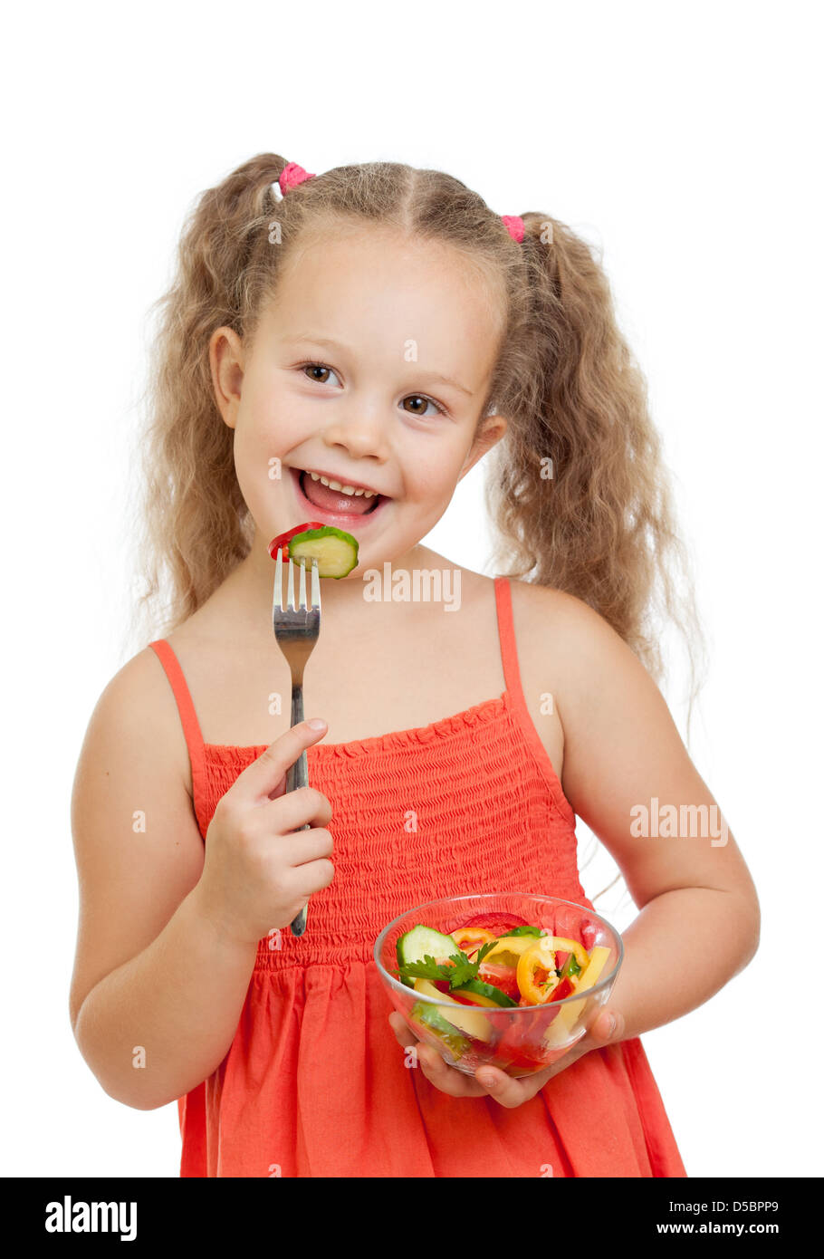 Ragazza bambino mangiare con cibo sano e verdure Foto Stock