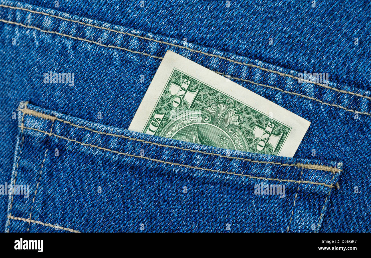 Un dollaro USA nella schiena tasca dei jeans Foto Stock