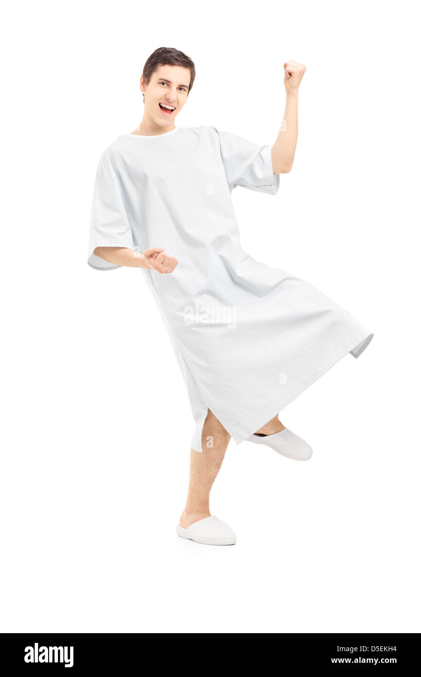 A piena lunghezza Ritratto di un paziente di sesso maschile gesticolando felicità, isolati su sfondo bianco Foto Stock