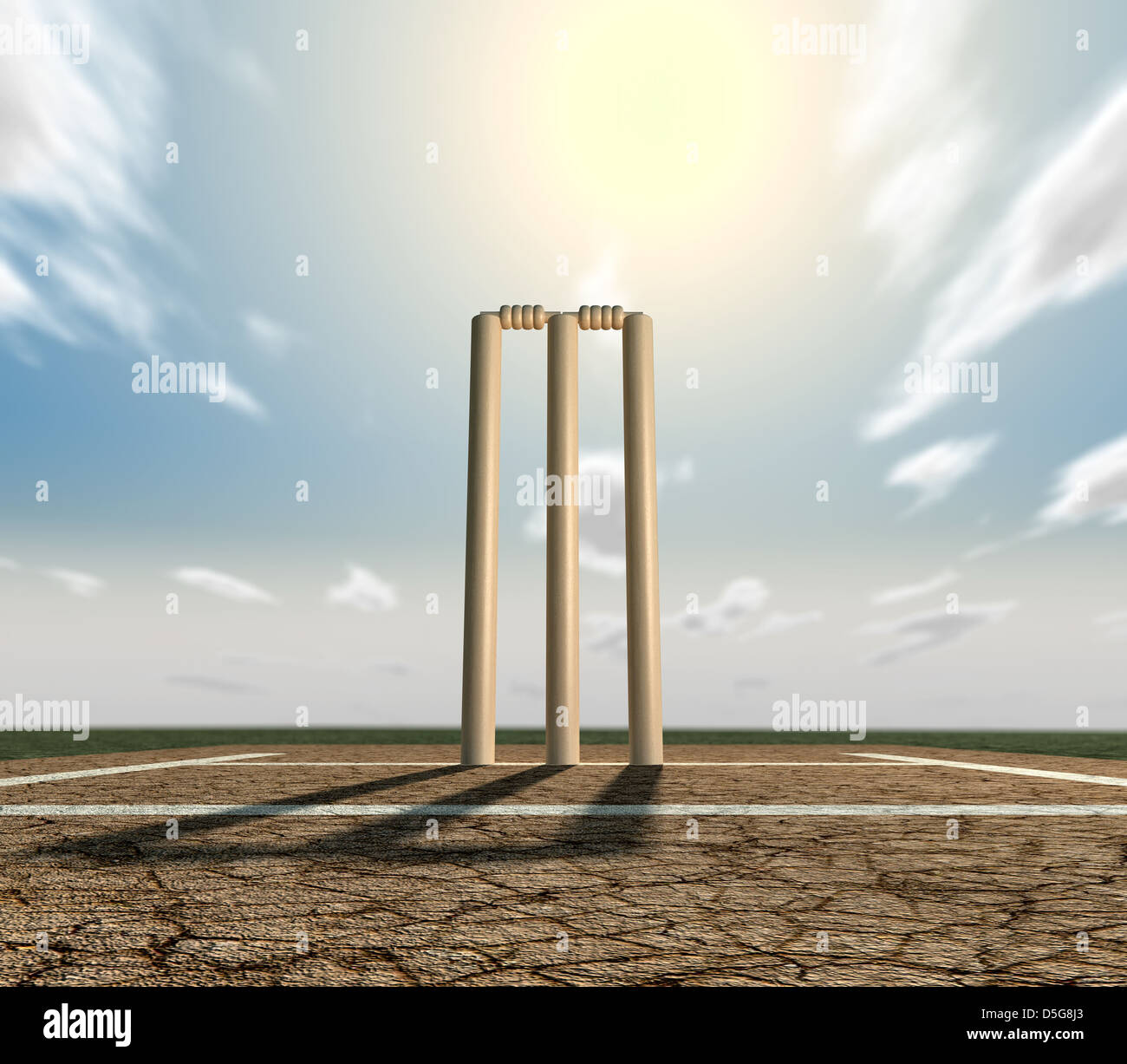 Un set di cricket wickets impostato su incrinature del campo da cricket con marcature bianche su un cielo blu sullo sfondo Foto Stock