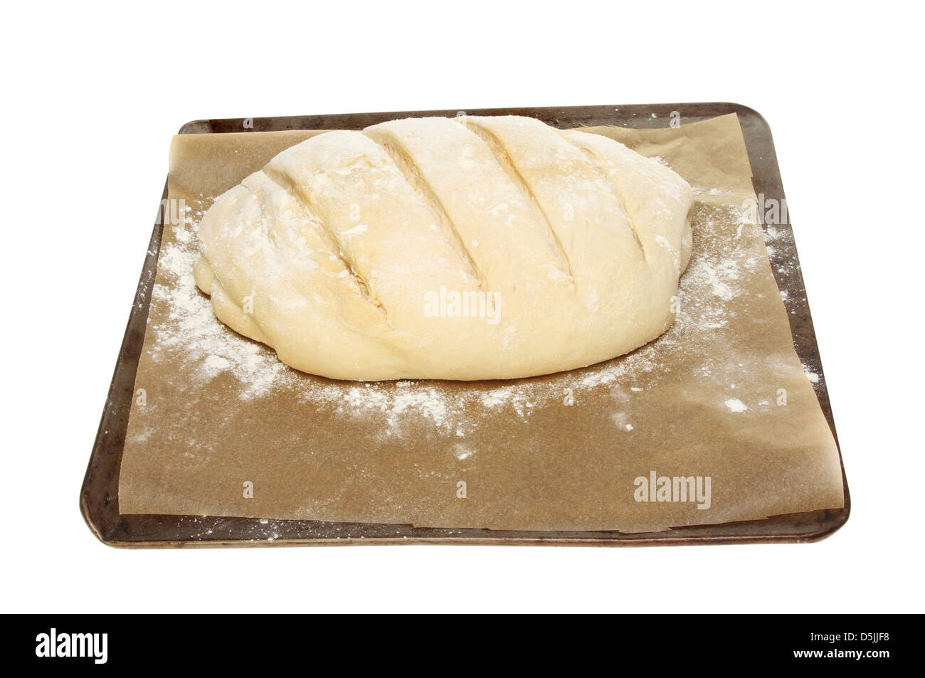 Dimostrando di pasta di pane su una placca da forno isolata contro bianco Foto Stock